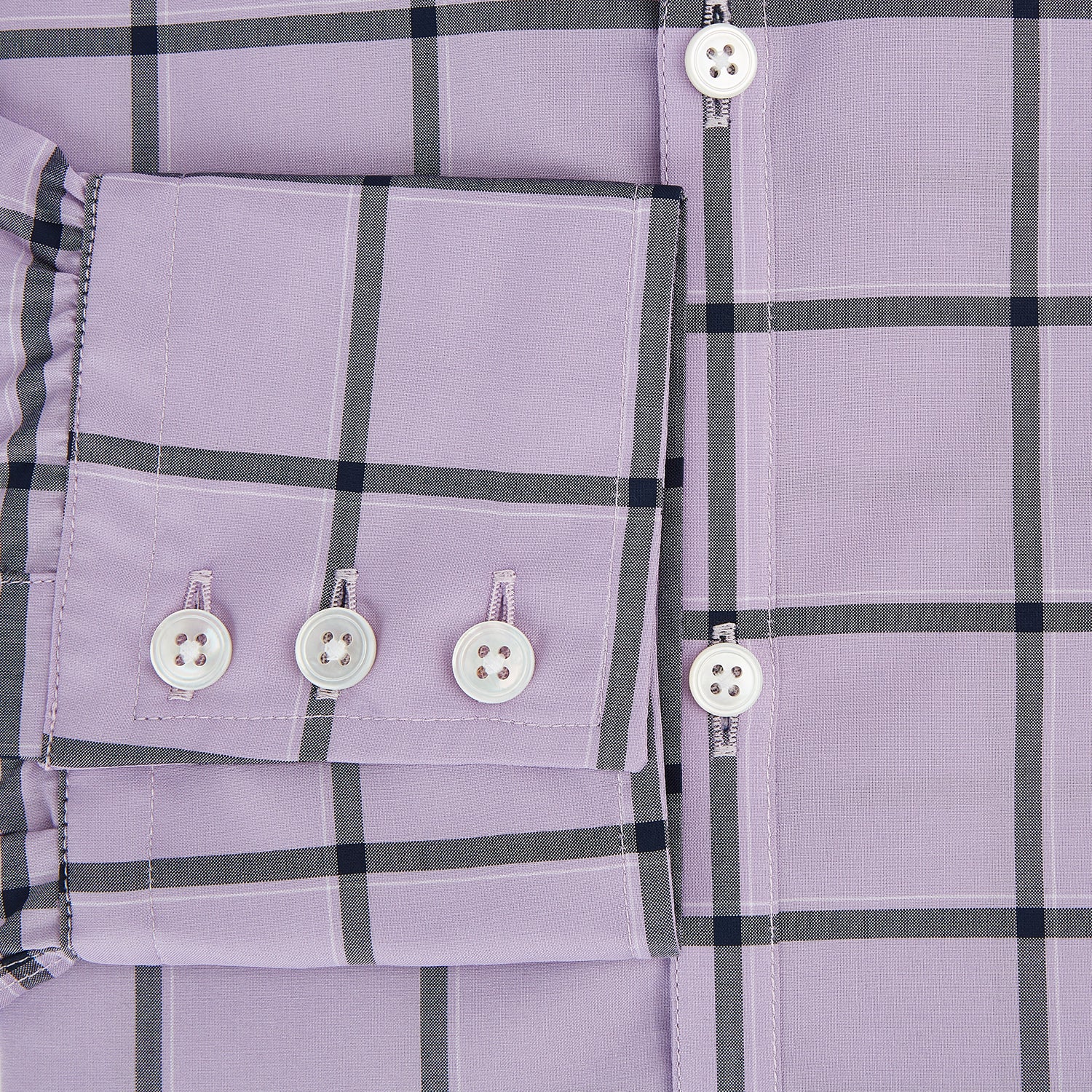 Image 4 of product A long-sleeve, button-up Lilac Grid Check Windsor Shirt by Turnbull & Asser, featuring a black windowpane pattern and a refined Windsor collar, displayed on a plain white background.