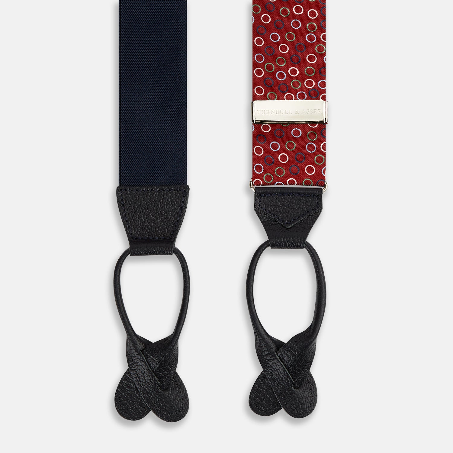 Image 2 of product Pink and navy circle red adjustable silk and navy leather braces by Turnbull & Asser, arranged in an M shape on a white background—a refined choice for sartorial styling and standout men’s accessories.