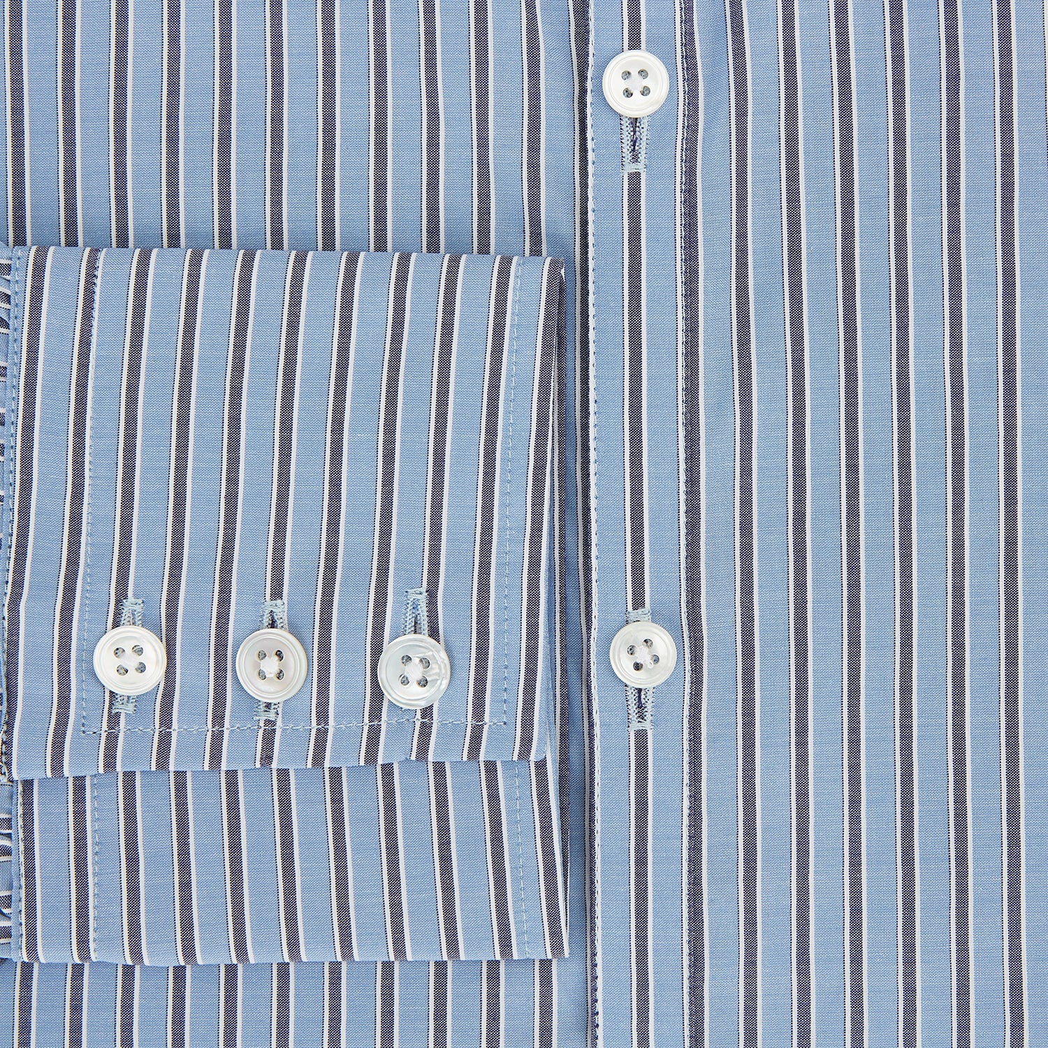 Image 4 of product The Steel Blue Ticking Stripe Westminster Shirt by Turnbull & Asser features a classic fit, Turnbull collar, vertical stripes, white buttons, and buttoned cuffs—showcasing refined British craftsmanship.