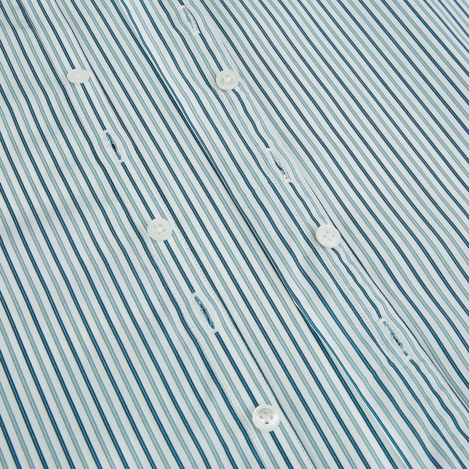 View 7 of product The GREEN DOUBLE STRIPE WESTMINSTER SHIRT by Turnbull & Asser features green and white vertical stripes, a pointed collar, buttoned cuffs, and a relaxed fit that highlights refined British craftsmanship.