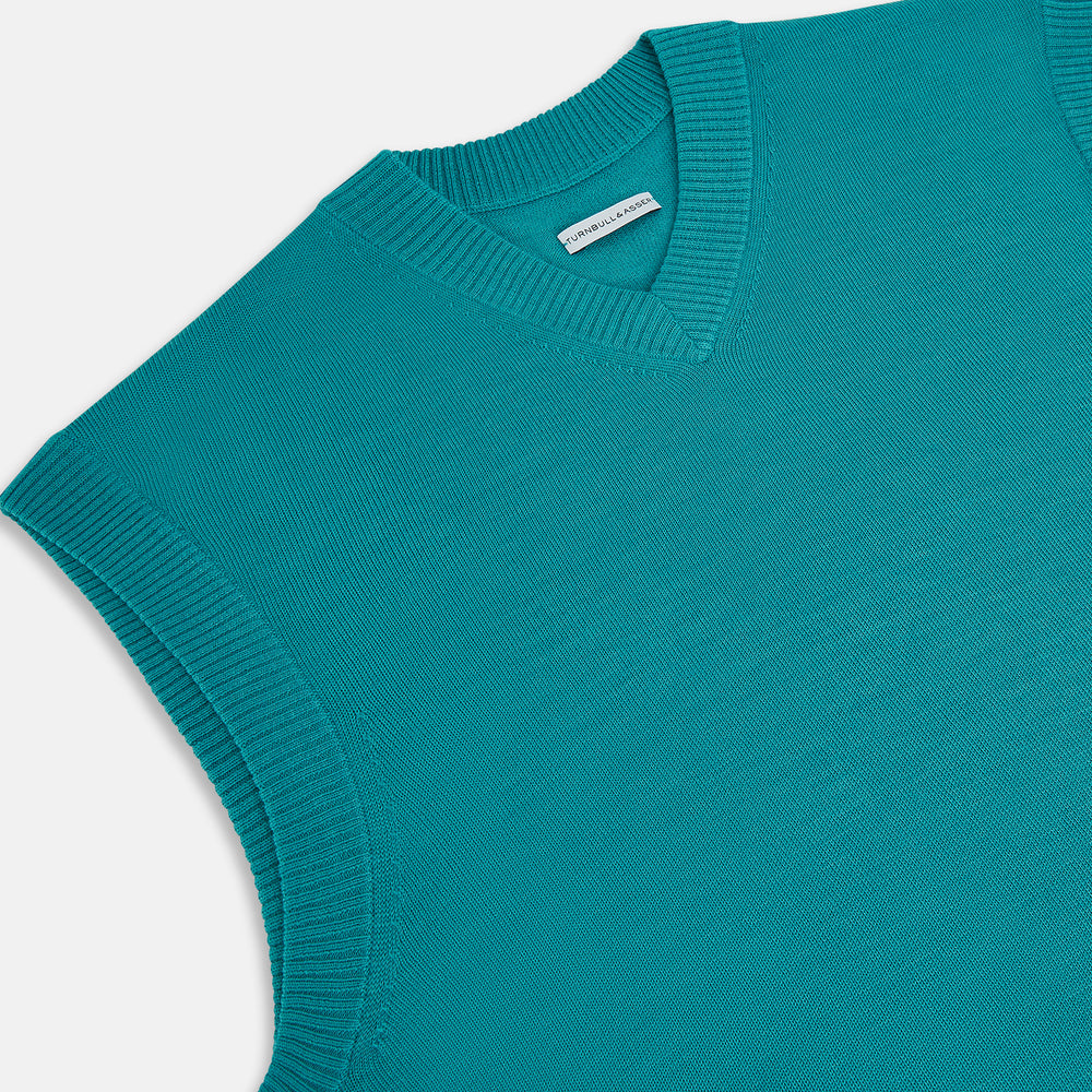Turnbull & Asser's Turquoise Fine Merino V-Neck Vest features ribbed edges and a sleeveless design, ideal for a refined look, shown against a plain white background.