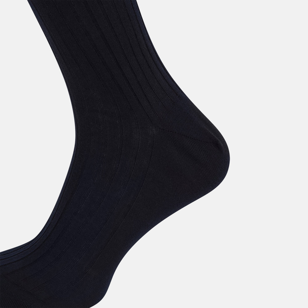 A single navy mid-length sock by Turnbull & Asser, crafted from organic cotton with a ribbed texture, stands upright on a white background.