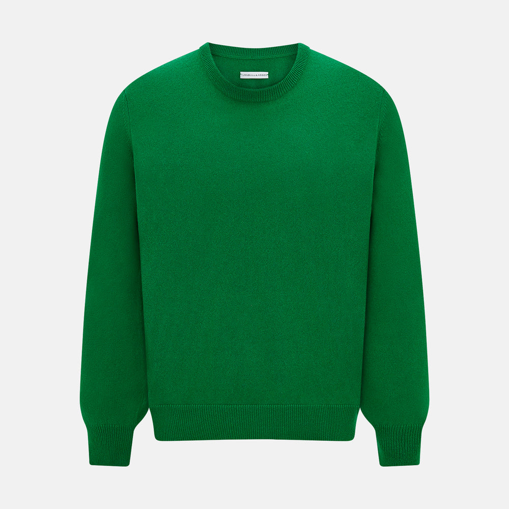 The Turnbull & Asser Grass Green Cashmere Round Neck Jumper features long sleeves, ribbed cuffs, collar, and hem, shown on a white background.