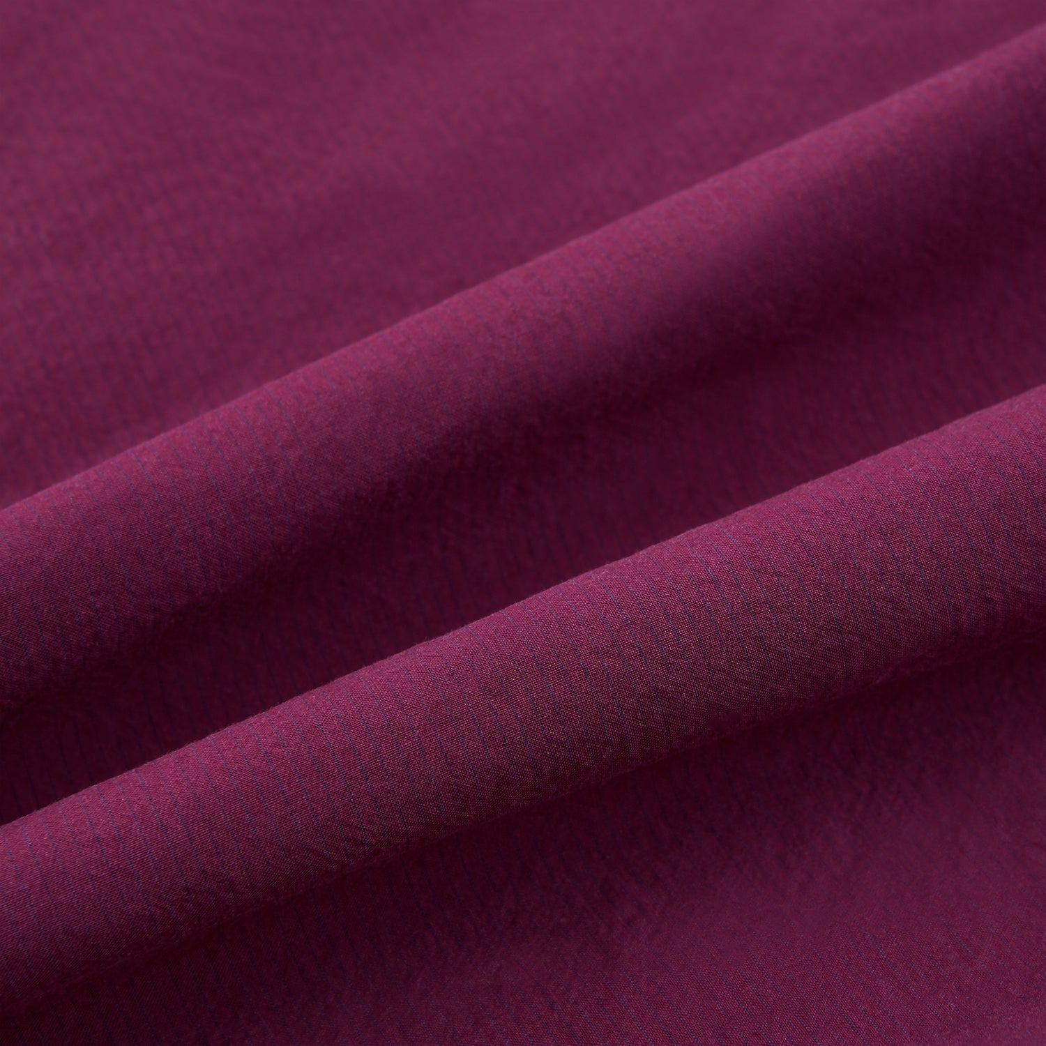 View 4 of product The Turnbull & Asser Wine Red Padded Gilet features a sleeveless design, front zipper, two zippered side pockets, a slanted chest pocket, and a rounded hem—perfect for the modern gentleman and shown on a plain white background.