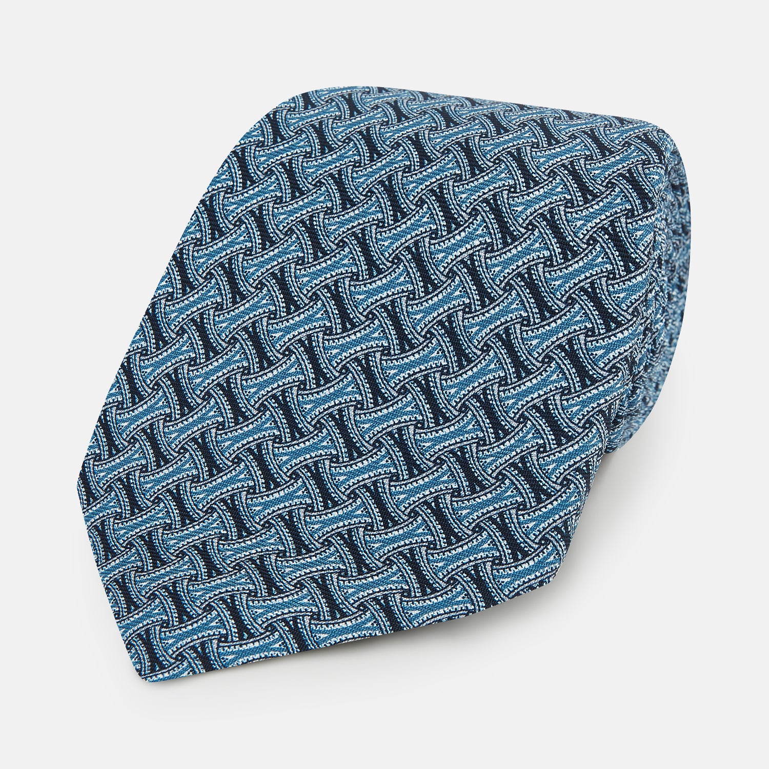 View 1 of product A rolled-up Turnbull & Asser Pale Blue and Navy Weave-Patterned Printed Silk Tie is shown against a white background.