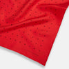 View 2 of product The Turnbull & Asser Red and Burgundy Spot Silk Pocket Square features evenly spaced small spots and the brand logo in the bottom right corner—perfect for formal wear. One corner is folded to show the reverse side.