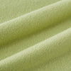 View 3 of product The Plain Canary Yellow Cashmere Knitted Scarf from Turnbull & Asser is a soft, premium accessory, elegantly draped against a white background—an essential addition to any wardrobe.