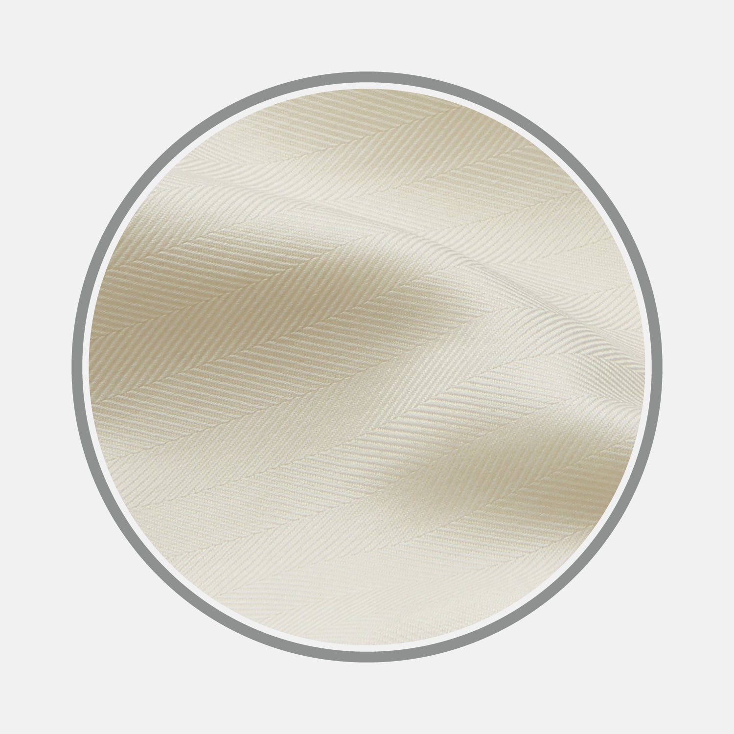 View 1 of product Close-up of Turnbull & Asser's Cream Herringbone Cotton Fabric, featuring gentle folds and a smooth, slightly shiny texture within a circular frame.