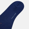 View 3 of product Turnbull & Asser’s Royal Blue Check Mid-Length Sock features a blue base with red, orange, and blue checks on the calf, shown against a plain white background.