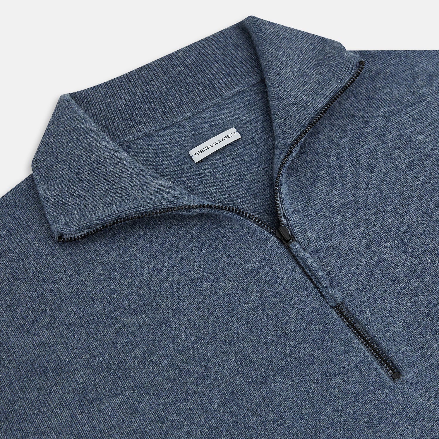 View 2 of product The Blue Melange Half-Zip Cashmere Jumper by Turnbull & Asser features a high collar, ribbed cuffs and hem, and long sleeves. This pullover sweater is shown against a plain white background.