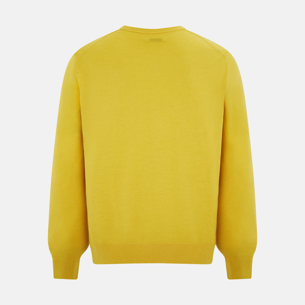The Turnbull & Asser Canary Yellow Fine Merino V-Neck Cardigan features long sleeves, a button front with brown buttons, and ribbed cuffs and hem, displayed on a plain white background.
