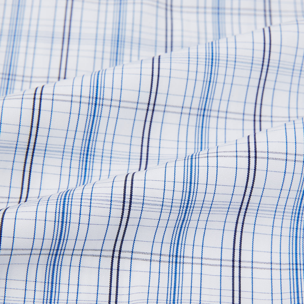 The Turnbull & Asser Blue and Navy Multi Check Mayfair Shirt features a classic T&A collar and long sleeves, with a blue multi-check pattern on white, neatly displayed against a plain white background.
