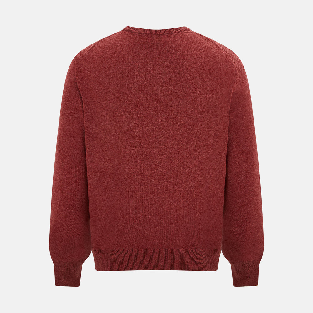 The Turnbull & Asser Crimson Red Cashmere Round Neck Jumper is a classic men’s knitwear piece, featuring long sleeves and a solid crimson hue, shown against a white background.