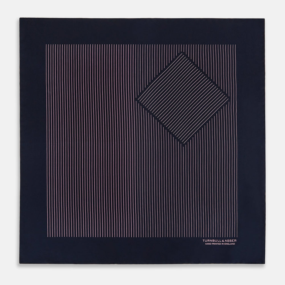 The Navy and Pink Stripe Silk Pocket Square by Turnbull & Asser features thin pink stripes, a geometric border, hand-rolled edges, and "TURNBULL & ASSER HAND PRINTED IN ENGLAND" printed in white.