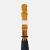 View 3 of product The Turnbull & Asser Navy Umbrella with Whangee Crook Handle is fully open, displaying its dark blue canopy and wooden curved handle against a plain white background.