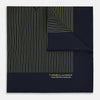 View 1 of product The Turnbull & Asser Navy and Gold Stripe Silk Pocket Square features light yellow vertical stripes, a folded corner, and "TURNBULL & ASSER HAND PRINTED IN ENGLAND" in gold at the bottom right.