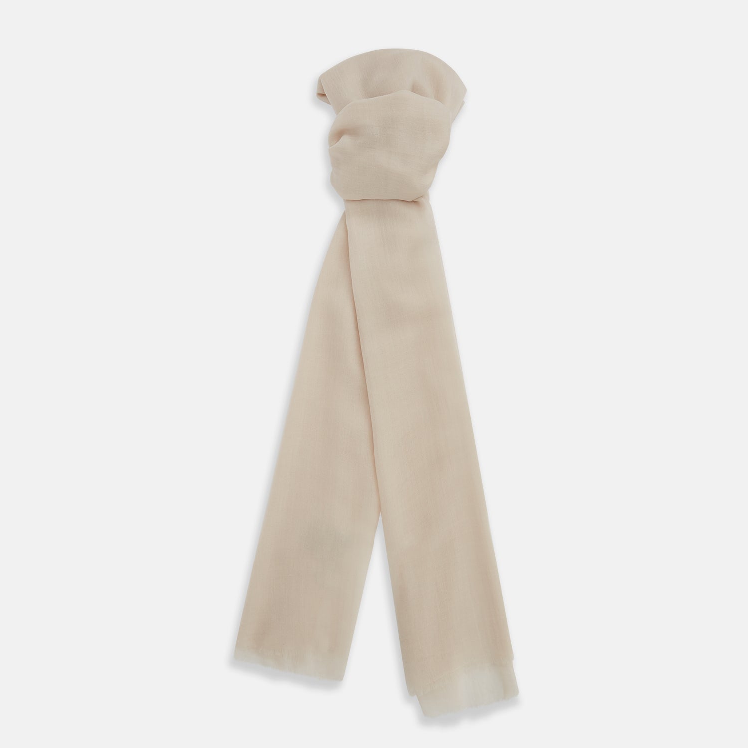 View 1 of product The Turnbull & Asser Rose Cashmere Scarf, in light beige and semi-sheer, is elegantly folded on a white background—an exquisite luxury accessory.