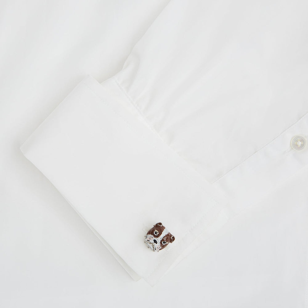 Turnbull & Asser’s British Bulldog Cufflinks, crafted in sterling silver and detailed with brown and white enamel to resemble bulldog heads, celebrate British heritage against a plain white background.
