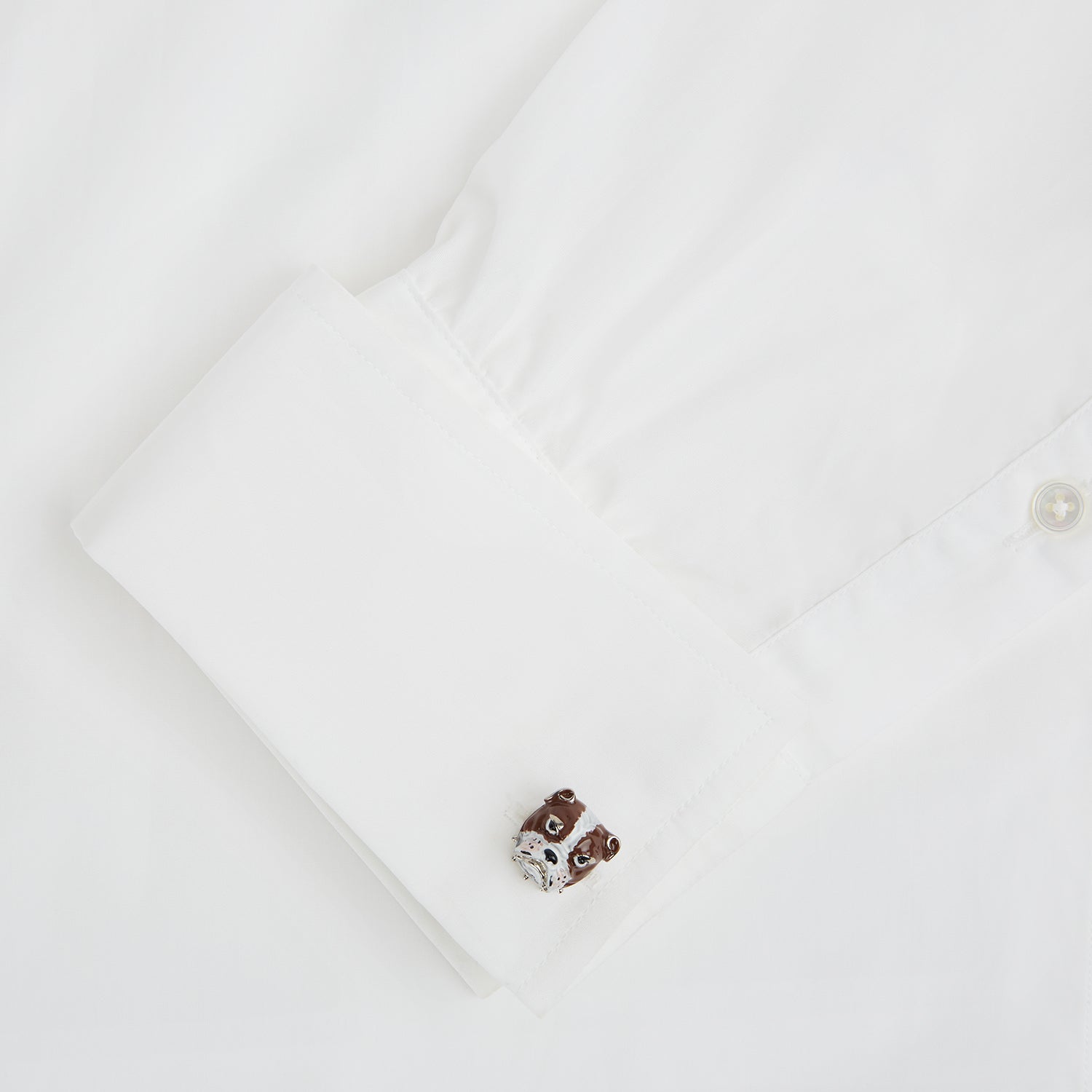 View 4 of product Turnbull & Asser’s British Bulldog Cufflinks, crafted in sterling silver and detailed with brown and white enamel to resemble bulldog heads, celebrate British heritage against a plain white background.