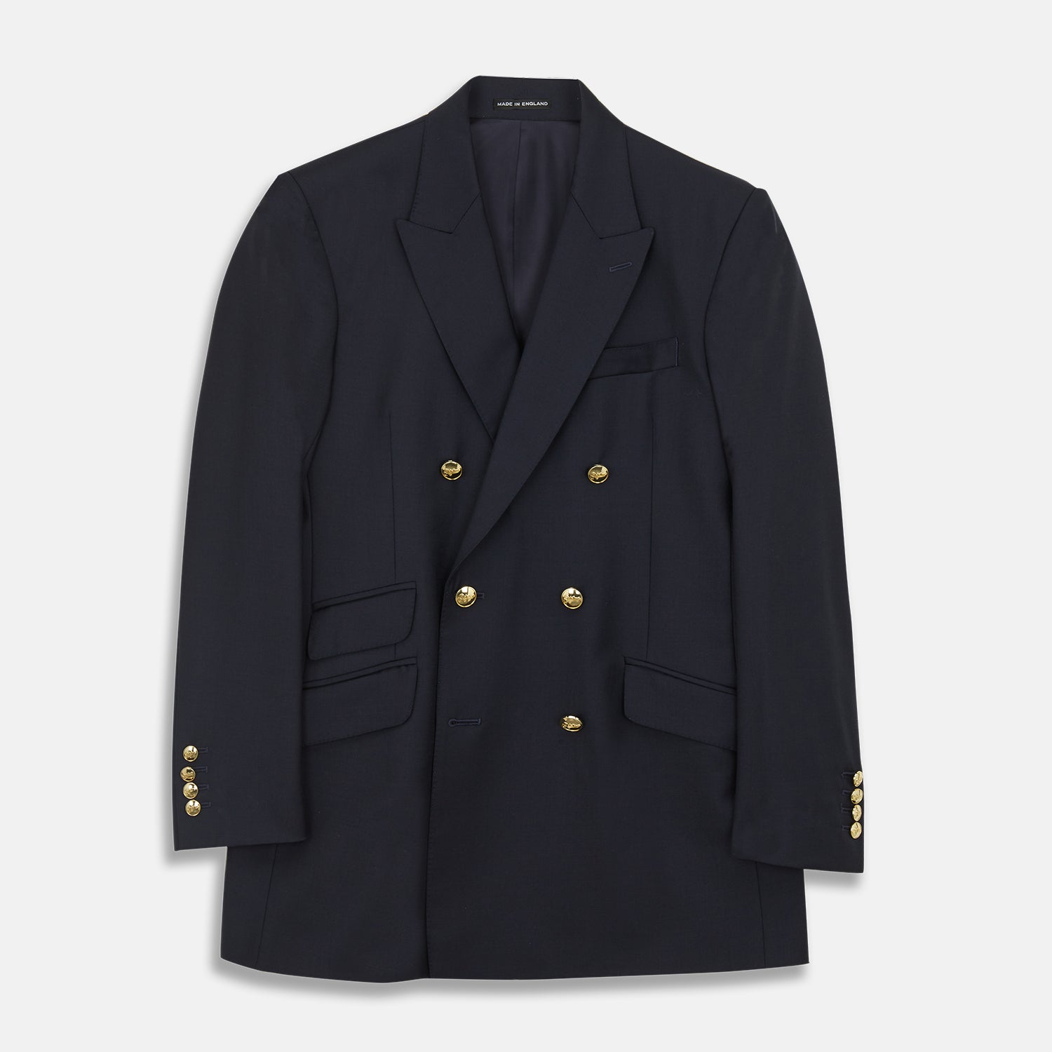 View 1 of product The Classic Navy Wool Blazer by Turnbull & Asser features a double-breasted design, gold buttons, notched lapels, and multiple front pockets, shown on a white background. This piece offers timeless, sophisticated nautical style.