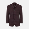View 1 of product The Fulham Burgundy Single-Breasted Quilted Blazer by Turnbull & Asser features a grid pattern, notch lapel, three buttons, and three front pockets. Shown on a plain white background—ideal for the modern gentleman.