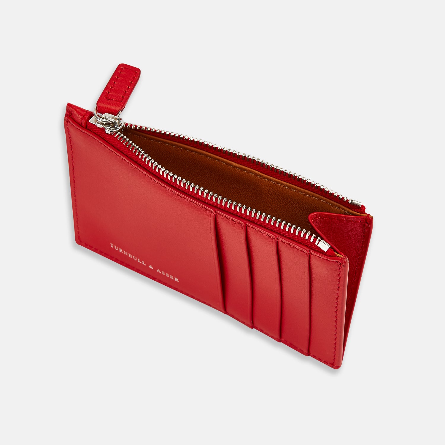 View 2 of product The Red Leather Zip Coin and Card Holder by Turnbull & Asser features four card slots, a slim pocket, a zip compartment, and white embossed branding on the front.