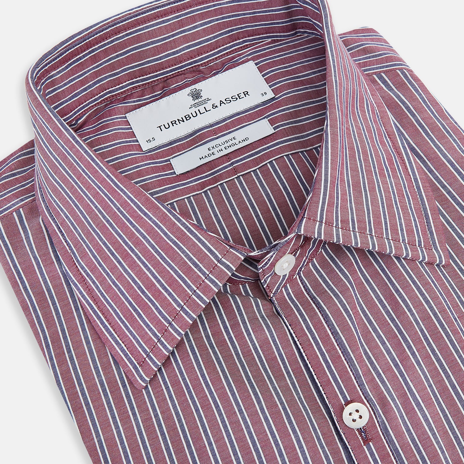 Image 2 of product The Turnbull & Asser Wine Ticking Stripe Westminster Shirt features red, blue, and white vertical pinstripes on white and is shown laid flat on a white surface.