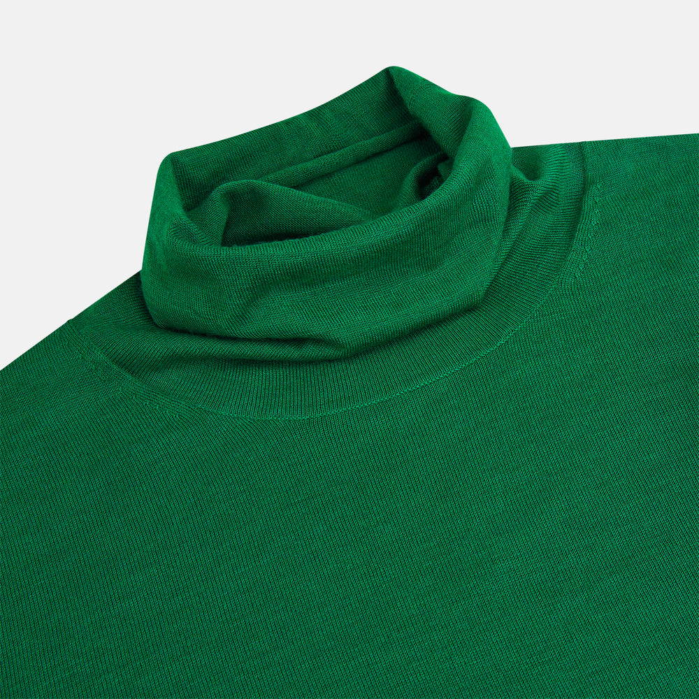 The Turnbull & Asser Hunter Green Fine Merino High Neck Jumper features a classic long-sleeve turtleneck style, crafted from soft merino wool and displayed against a crisp white background.