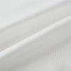 View 3 of product The Turnbull & Asser White Silk Scarf features fringed edges and discreet black branding in the corner, making it a refined accessory for tuxedo jackets or formal wear. Presented neatly folded on a plain white background.