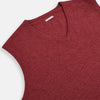 View 2 of product A refined piece from Turnbull & Asser, the Antique Pink Cashmere V-Neck Vest features a sleeveless design with a ribbed hem, shown against a plain white background.
