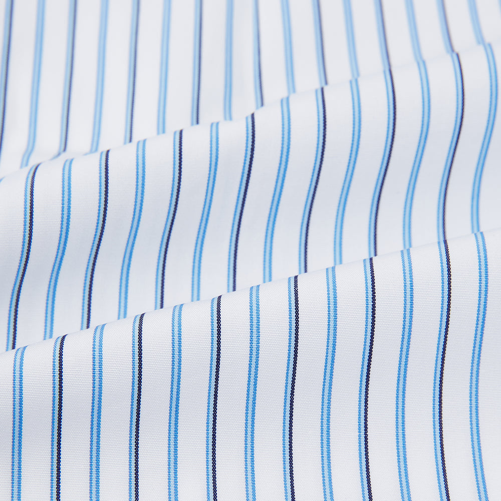 The Blue and Navy Double Stripe Mayfair Shirt by Turnbull & Asser features a classic T&A collar and thin blue stripes on a white background, displayed against a plain white surface.