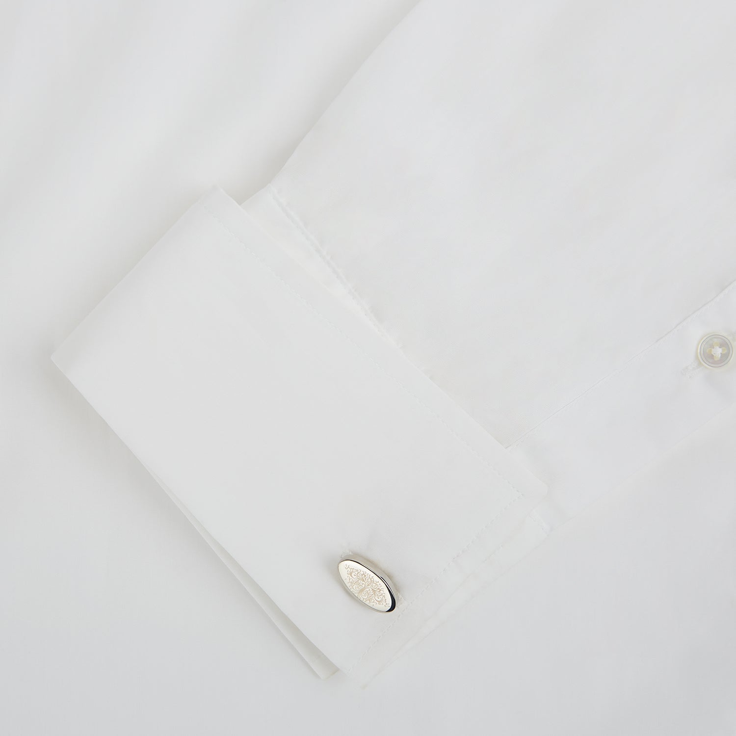 View 3 of product Turnbull & Asser Silver Antique Floral Oval Cufflinks feature engraved floral designs on oval faces, shown against a white background.