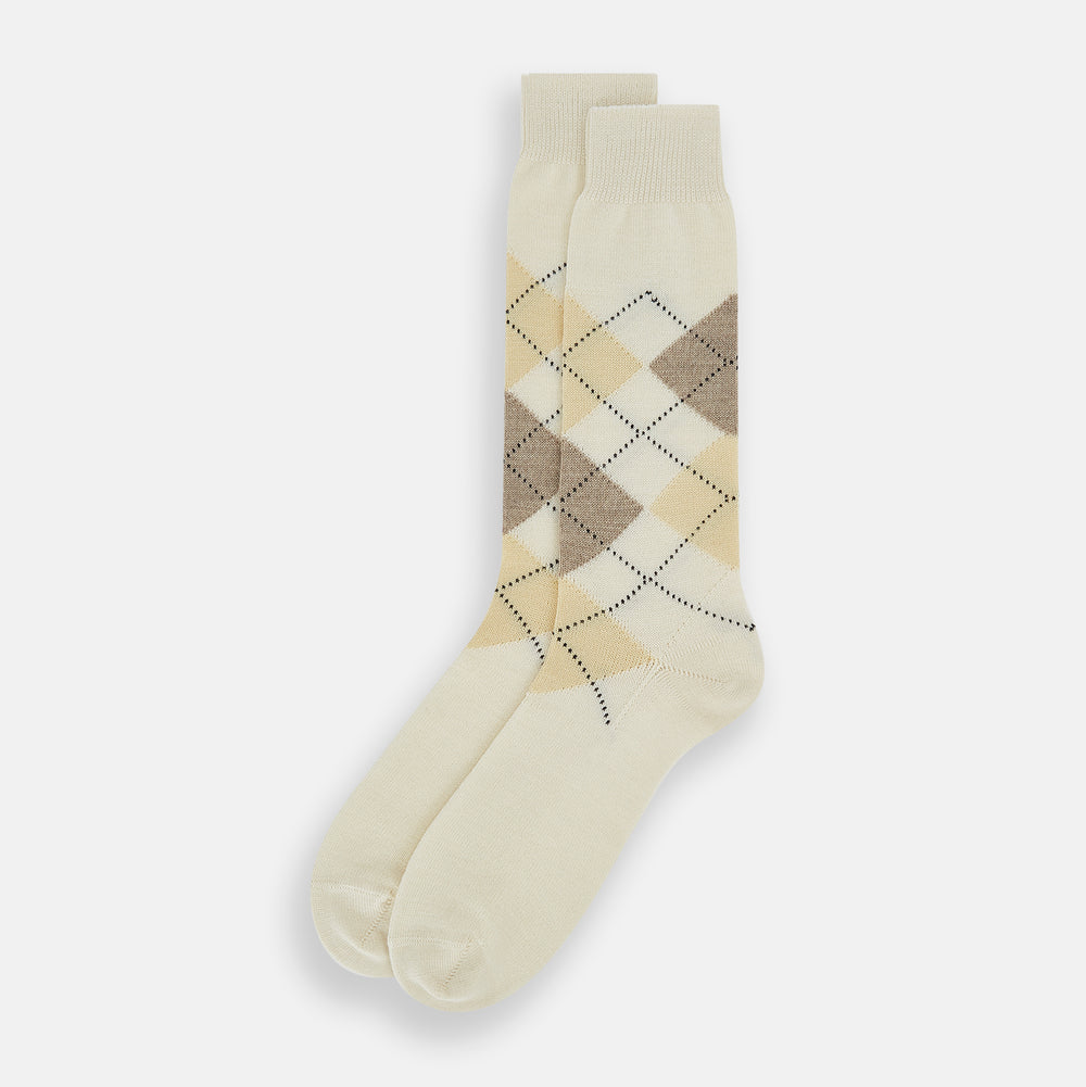 A single Turnbull & Asser White Wool Check Mid-Length Sock, featuring a subtle check pattern in tan, cream, and light brown shades, is displayed on a plain white background.