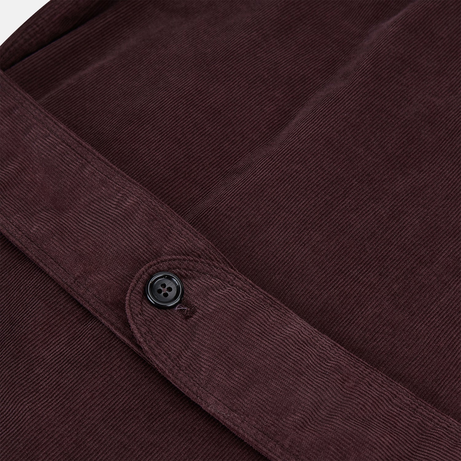 Image 4 of product The Burgundy Kingston Corduroy Caban Jacket by Turnbull & Asser features black buttons, a notched collar, and front pockets. Crafted from premium cotton, it is shown on a plain white background.