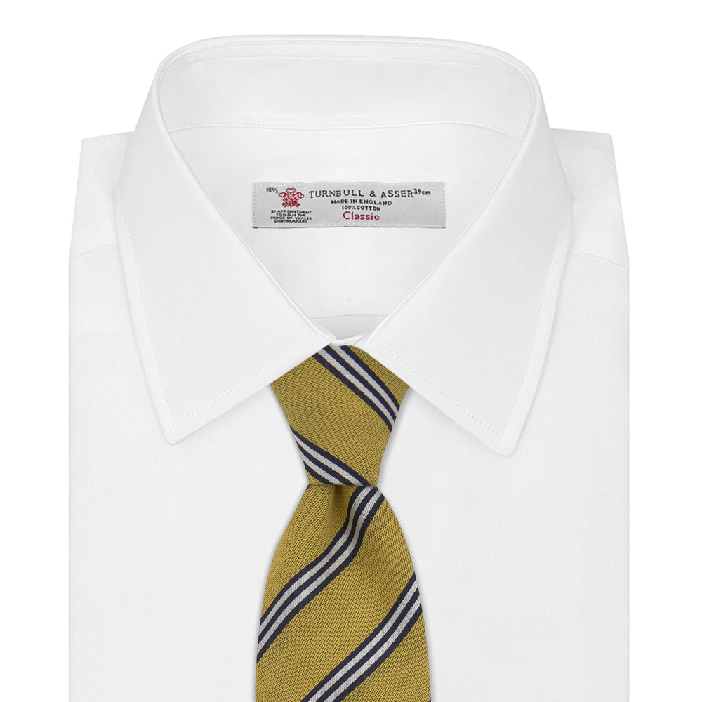 The Turnbull & Asser GGT92000 3042 11 OS is a classic yellow necktie with diagonal black and white stripes, rolled elegantly on a white background.