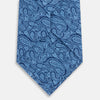 View 3 of product The Turnbull & Asser Azzurro Paisley Silk Tie features an intricate light blue pattern and is crafted from fine English silk—an elegant men's necktie displayed rolled up on a plain white background.