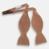 View 2 of product The Turnbull & Asser Brown and White Diamond Silk Bow Tie features a diamond pattern, ideal for formal occasions, showcased on a white background.