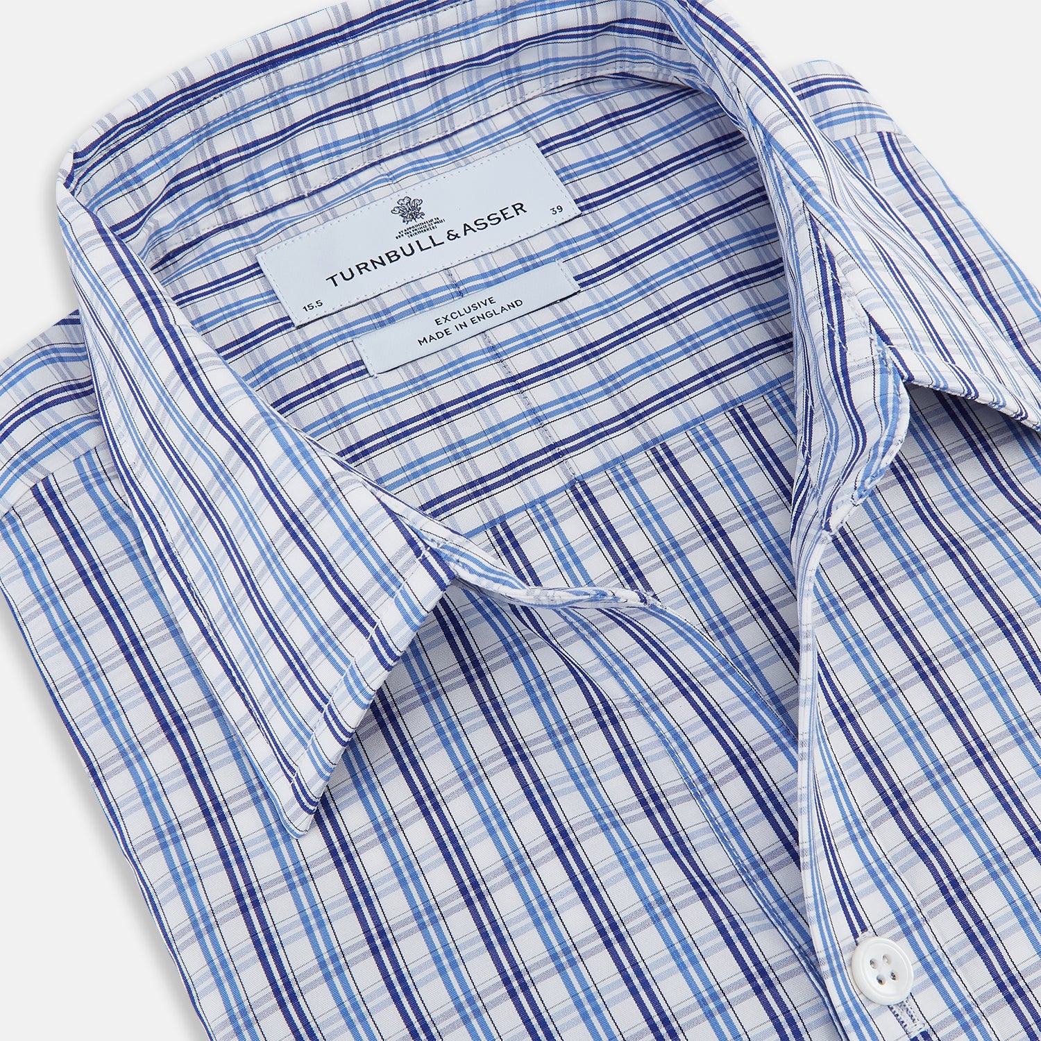 View 2 of product Turnbull & Asser's Blue and Navy Multi Check Piccadilly Shirt features long sleeves, a pointed collar, and two buttoned chest pockets, shown on a white background.