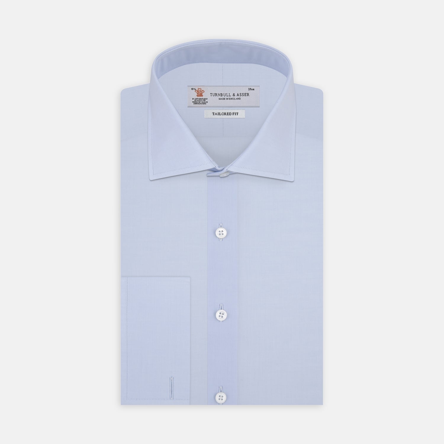 View 1 of product Displayed on a plain white background, the Turnbull & Asser Tailored Fit Two-Fold 120 Light Blue Cotton Shirt features a kent collar, double cuffs, and white buttons. The label inside highlights its Jermyn Street, London origin.