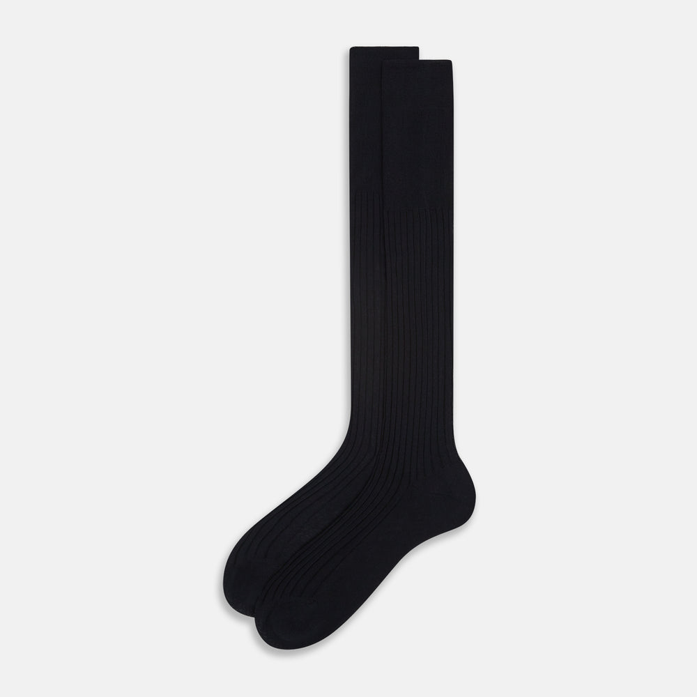 A single Midnight Blue Long Sock by Turnbull & Asser is shown on a white background, showcasing a ribbed texture and a fitted design that extends from the foot to the top of the calf.