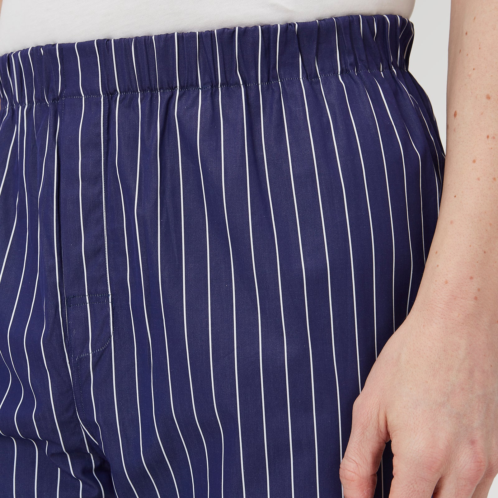 View 4 of product Turnbull & Asser Navy Stripe Modern Pyjama Trousers in superfine cotton with white stripes, elastic waistband, and relaxed fit, presented against a plain white background.