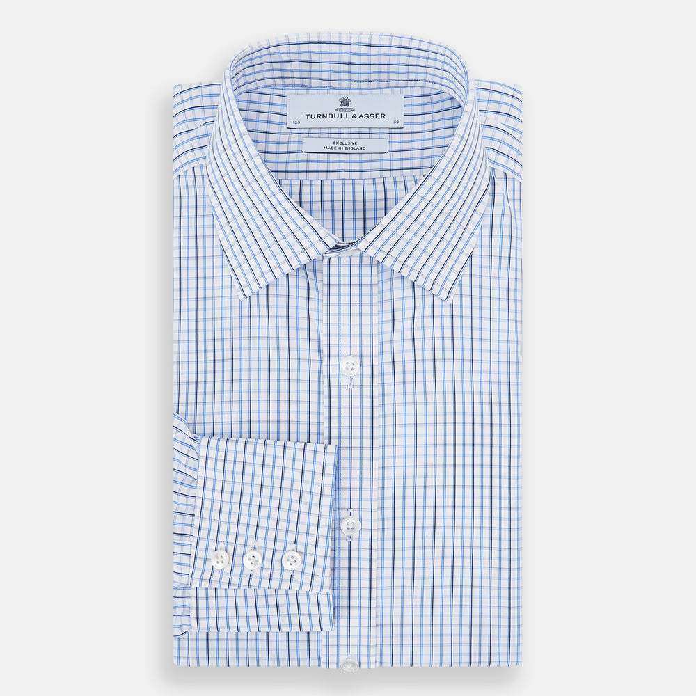 The Turnbull & Asser Blue and Navy Tattersall Check Mayfair Shirt features long sleeves, a button-up front, and a T&A collar in the classic Mayfair fit, shown flat against a white background.