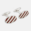 View 1 of product Turnbull & Asser's Burgundy and White Striped Oval Enamel Cufflinks feature a diagonal pattern in silver, embodying masculine elegance.