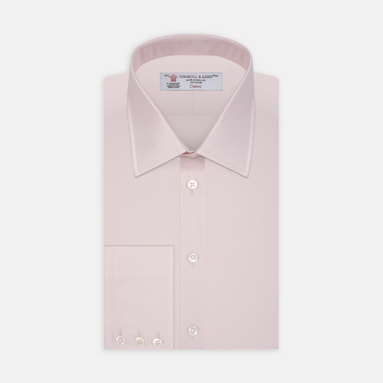 View 2 of product A close-up of Turnbull & Asser's Pink Cotton Fabric shows its fine, smooth texture and subtle stitching inside a circular gray-bordered frame against a white background.