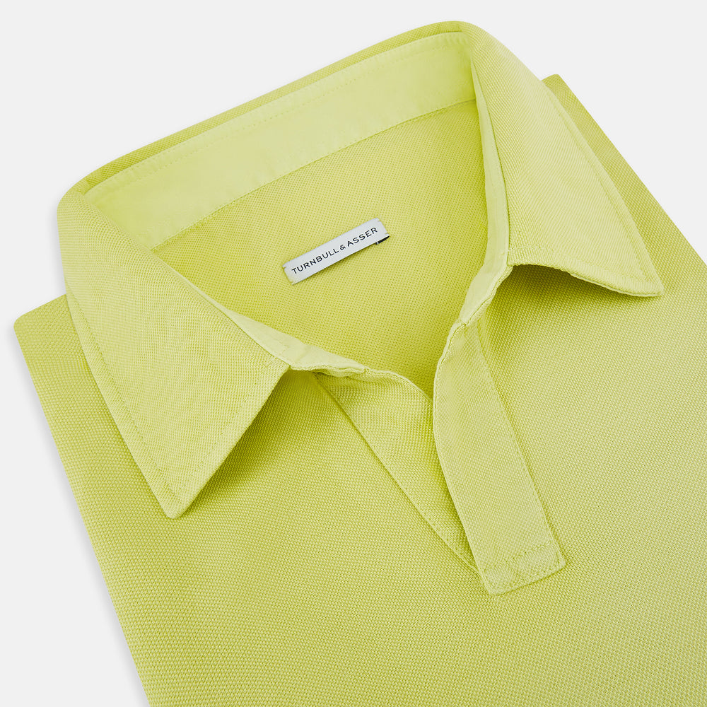 The Turnbull & Asser Lime Green Rugby Polo Shirt is a pure cotton, long-sleeve shirt with a collar and no visible buttons, displayed flat against a white background.