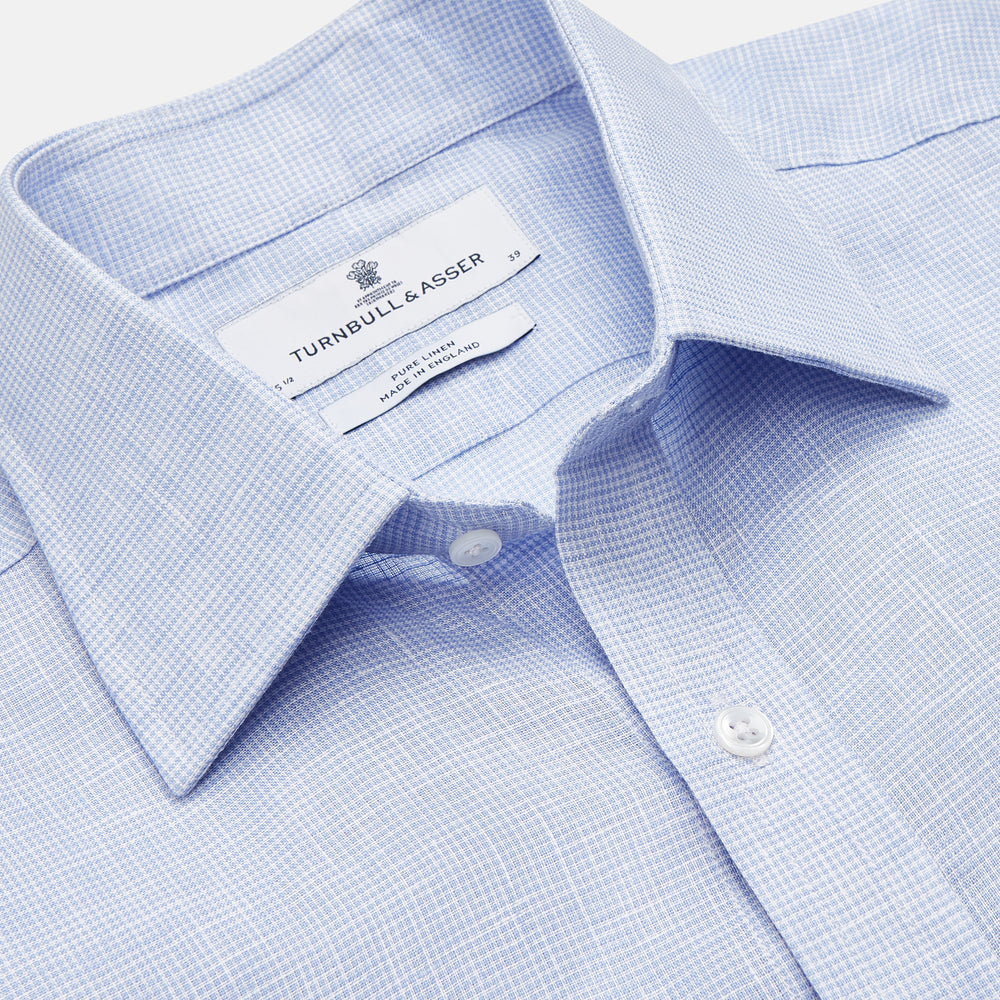 Turnbull & Asser's Pale Blue Check Linen Regular Fit Mayfair Shirt features a classic collar, front pocket, and buttoned cuffs—a breezy update to the traditional check shirt.