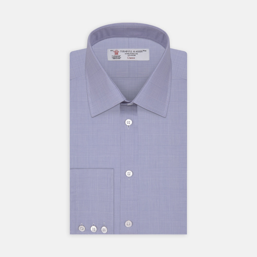 A Blue Prince of Wales Check Shirt by Turnbull & Asser, featuring a T&A collar and 3-button cuffs, is neatly folded and displayed on a plain white background.