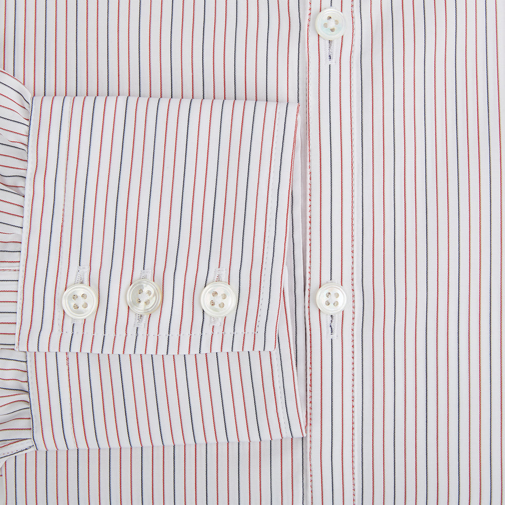 The Turnbull & Asser Red and Blue Ticking Stripe Westminster Shirt features long sleeves, a button-up front, pointed collar, and buttoned cuffs, highlighting British craftsmanship while laid flat on a white background.