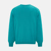 View 3 of product The Turnbull & Asser Turquoise Fine Merino V-Neck Cardigan features long sleeves, ribbed cuffs and hem, and black buttons, showcased against a plain white background.