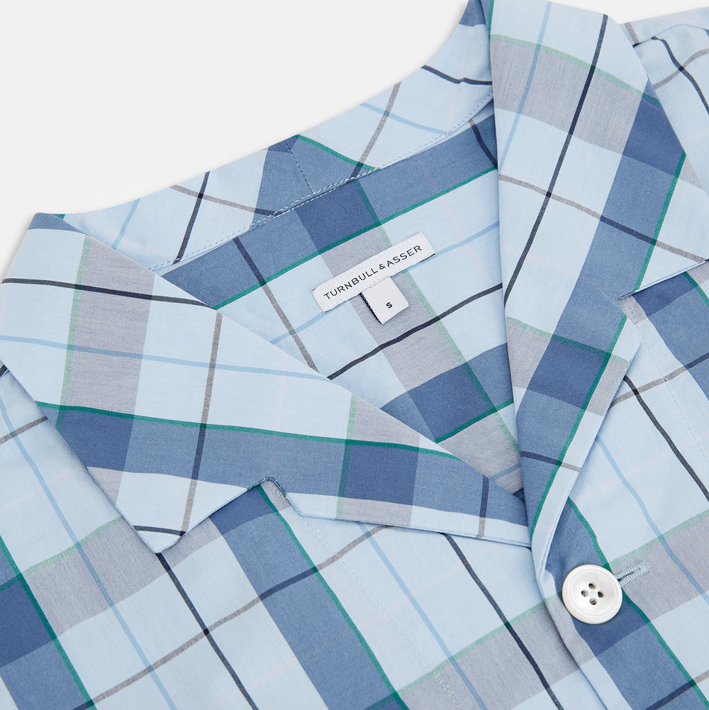 The Turnbull & Asser Blue Multi Check Pyjama Shirt features a blue and white check pattern, long sleeves, and a collar—an elegant loungewear option perfect for nightwear.